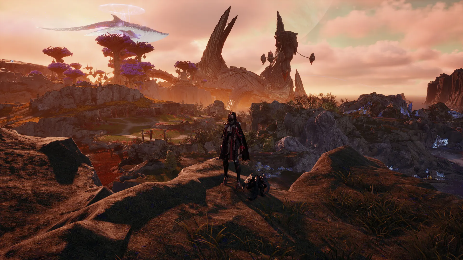 A sweeping sunset landscape with a sky whale drifting above purple mushroom trees and horn-shaped ruins, a lone traveler on a rocky rise.
