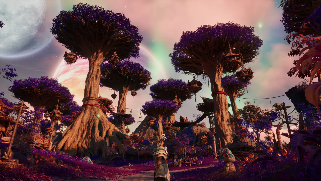 Giant purple-canopied trees hung with lanterns tower over a village under a pastel aurora sky with a ringed planet and a moon.